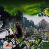 A cyclist rides past a graffiti wall covered with green hearts