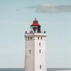 Rubjerg Knude Lighthouse in front of blue sky, North Jutland in Denmark