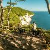A couple with their bikes, exploring the coastland near Møns Klint