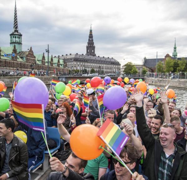 A lively canal tour during Pride Week in Copenhagen, Denmark