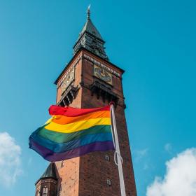 A rainbow flag flies in front of Copenhagen's City Hall to celebrate LGBTQI+ pride week