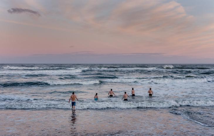 Winter bathers going into the water on a winter morning on Klitmoeller Beach in Thy, North Jutland